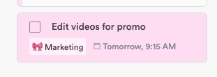 A selected task card tinted pink to match its Marketing project